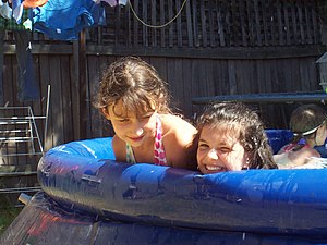 Girls playing in a small pool.jpg