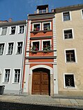 Residential house in closed development, with courtyard wing