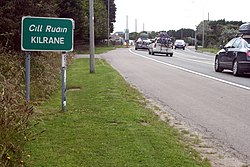 Signage and road traffic on the N25 at Kilrane