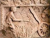 Gallisch-Romeinse maaimachine (afbeelding op een muur in het Belgische Buzenol)