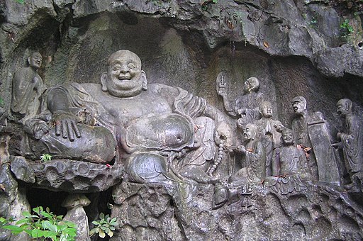 Maitreya and disciples carving in Feilai Feng Caves