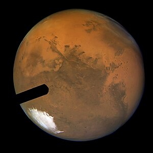 Hubble's sharpest view of Mars: Although the ACS "Fastie finger" intrudes, it achieved a spatial scale of 5 miles, or 8 kilometres per pixel at full resolution. Mars close encounter (captured by the Hubble Space Telescope).jpg