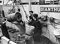 Anti-Submarine Weapons: A Mk VII depth charge being loaded onto a Mk IV depth charge thrower on board HMS Dianthus. 14 August 1942