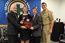 McGinn (far left) and Vice Adm. William H. Hilarides, commander of Naval Sea Systems Command (far right) present the Safety Integration in Acquisition Award to Rebecca Funkhouser and Robert Heflin on October 20, 2014. NSWC Dahlgren System Safety Practitioners Receive SECNAV Safety Excellence Award 141020-N-ZZ999-001.jpg