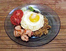 Nasi goreng with shrimp and egg, a typical Indonesian breakfast Nasi Goreng Udang Istimewa.JPG