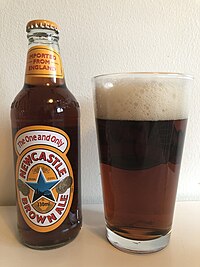 Newcastle Brown Ale poured in pint glass.jpg