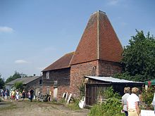 The square oast house of Buss Farm, featured in the opening credits, seen in 2007 Oast House at Buss Farm, Pluckley Road, Bethersden, Kent - geograph.org.uk - 1550712.jpg