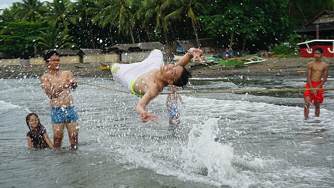 Jump with peace sign in Butuan Bay.