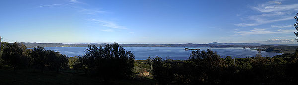 The eastern shore viewed from highway SS312 Castrense between Valentano and Latera on the western shore. Center is Bisentina, with Martana to the right and the headland of Capodimonte to the right of it. The city on the left of the far shore is Bolsena Panoramica lago bolsena.jpg