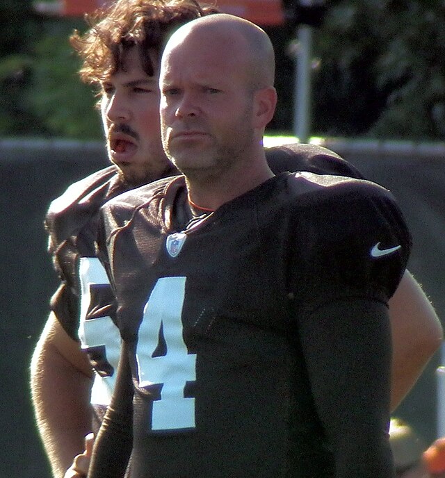 Cleveland Browns kicker Phil Dawson swings his daughter Sophiann