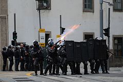 Riot control group of Rio de Janeiro Police in confrontation with protesters in the historical center of the city.