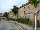 Settlement of the civil servants' housing association in Potsdam (including expansion) with open spaces, paving and greening of the streets