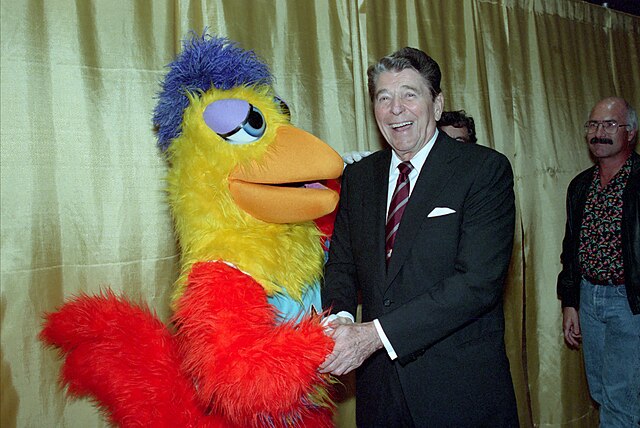 The San Diego Chicken, portrayed by Ted Giannoulas, was a staple in the San Diego area during the 1970s and 80s. On the right is United States Preside