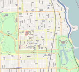 a street map with a portion of a block designated with red borders. The map also has several large green areas designating undeveloped land.