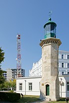 Restorated medieval lighthouse and modern radio tower.jpg