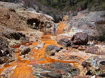 River water stained by mine waste, Spain