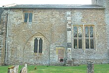 North wall of the nave of SS Leonard and James', showing large 16th-century window and blocked arch to former 14th-century chantry chapel Rousham SSLeonard&James north.JPG