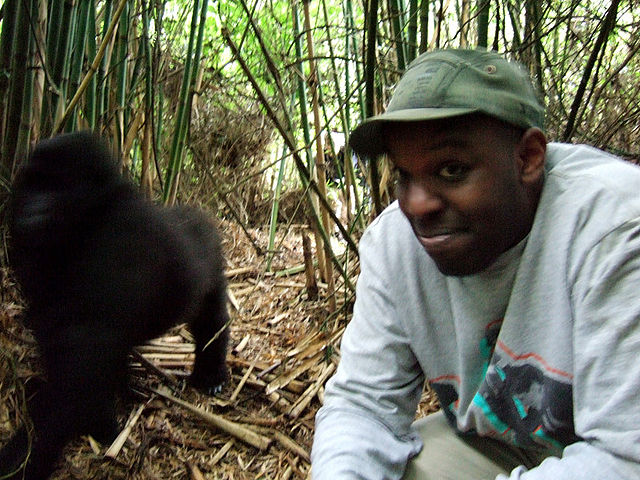 Shad photographed with a gorilla while on a visit to Rwanda, 2006