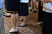 different shoes worn to holiday/ traditional costumes by women and youg girls, who carried flags in church for Spas holiday