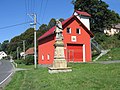 Statue of Saint John of Nepomuk and firehouse