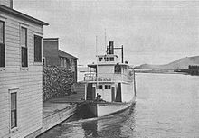 Klamath at dock at Klamath Falls, circa 1907. Note stacked cordwood for fuel on the dock, and protective log boom in water in front of vessel. Steamer Klamath at dock at Klamath Falls circa 1907.jpg