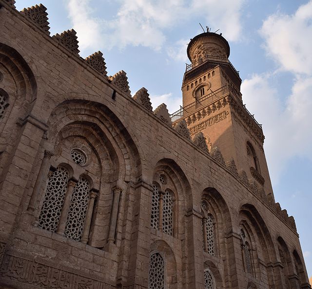 View of minaret and grilled windows from the façade