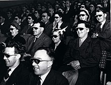 Audience wearing special glasses watch a 3D "stereoscopic film" at the Telekinema on the South Bank in London during the Festival of Britain in 1951. The National Archives UK - WORK 25-208.jpg