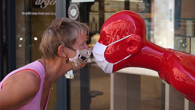 Two masked faces face to face, Bordeaux, France