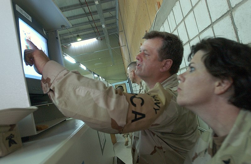 File:US Navy 050301-N-6027E-003 Aircrew Survival Equipmentman 2nd Class Thomas Friedrich, left, and Disbursing Clerk 2nd Class Teresa Chalmers, check an X-Ray of carry-on baggage.jpg