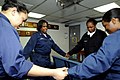 US Navy 090416-N-7478G-112 Participants in the amphibious command ship USS Blue Ridge (LCC 19) women's Bible study group pray during a weekly Bible study while the ship is underway.jpg