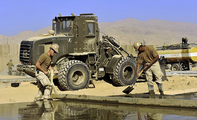 File:US Navy 101123-N-6436W-092 Seabees assigned to Naval Mobile Construction Battalion (NMCB) 40 work with local Afghani contractors to place concrete.jpg