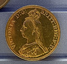 A gold coin with a profile of Queen Victoria, wearing small, round-top crown, facing left