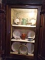 Wall cupboard with crockery