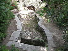 A 1st century AD wine pressing trough from the Old City of Jerusalem Winepress in Old City Jerusalem.jpg