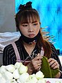 Woman Flower Vendor - Wat Phra That Doi Suthep - Outside Chiang Mai - Thailand (35153801405).jpg