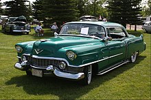 1954 Cadillac Coupe DeVille featuring prominent bullet-shaped Dagmar bumpers 1954 Cadillac DeVille (9503936759).jpg