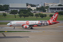 Ninetology and Qualcomm livery on AirAsia aircraft in 2014. 9M-AHG (18790513158).jpg