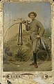 A cyclist with his penny farthing, 1883 (14138826621).jpg