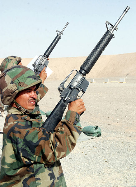 Afghan National Army riflemen performing safety checks on their M16 rifles at a firing range, 2010