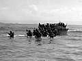 Amphibious craft unload men and equipment on beachhead in Leyte Philippines. October 20, 1944