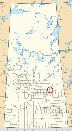 Карта провинции Саскачеван, на которой показаны 297 сельских муниципалитетов и сотни небольших индейских заповедников. Один выделен красным кружком.