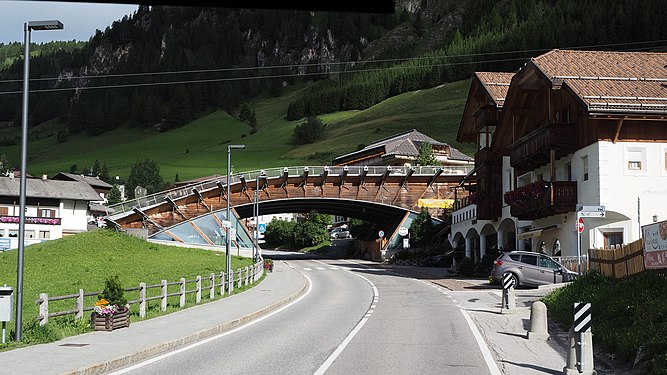 Ski slope bridge across the road in Italy