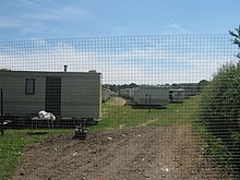 This large field is filled with mobile homes. Temporary accommodation for many migrant workers working on the acres of orchards of Selling Court Farm. Caravan Town - geograph.org.uk - 1370356.jpg