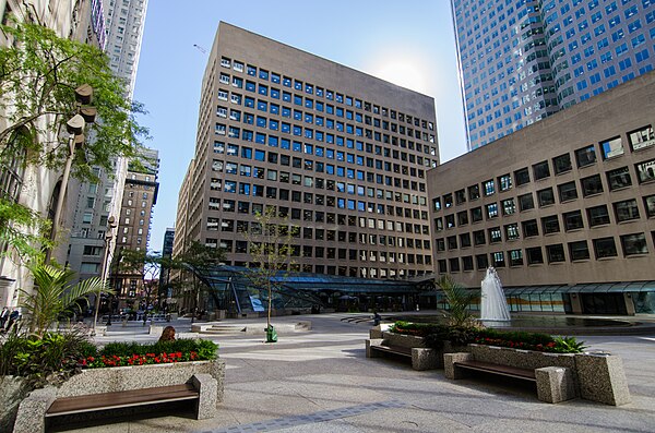 The complex features an outdoor central plaza with a fountain. Commerce Court East (centre) and Commerce Court South (right) are visible in the backgr