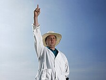 An umpire signalling a dismissal Cricket Umpire dismissal.jpg