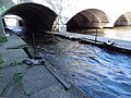 Detail of downstream gates of Pawtucket Gatehouse swing-gated underpass of O'Donnell Bridge. This is the beginning of the Lowell Canal System's Northern Canal. Located at the southeast end of the O'Donnell Bridge in Lowell, Massachusetts.