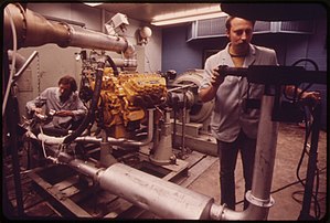 Evaluation and Development control room in the EPA's Motor Vehicle Test Center in Ann Arbor, Michigan, 1973 EVALUATION AND DEVELOPMENT CONTROL ROOM AT EPA'S ANN ARBOR MOTOR VEHICLE EMISSIONS TEST CENTER - NARA - 549684.jpg