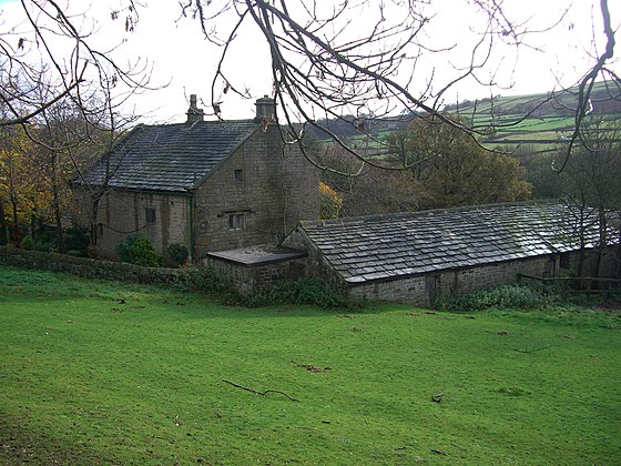 The house seen from Annet Lane with the outbuildings on the right hand side.