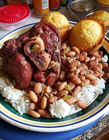 Ham hock cooked with pinto beans, served with white rice and cornbread. Ham hock and beans 082919.jpg