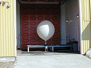 Hydrogen filled balloon ready for launch. The radiosonde can be seen on the wooden stand.